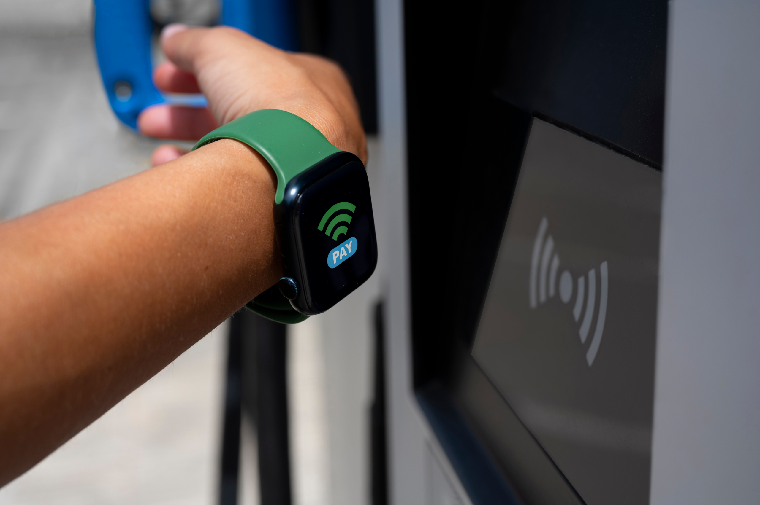 Guest tapping an RFID card and RFID wristband at an entertainment venue reader